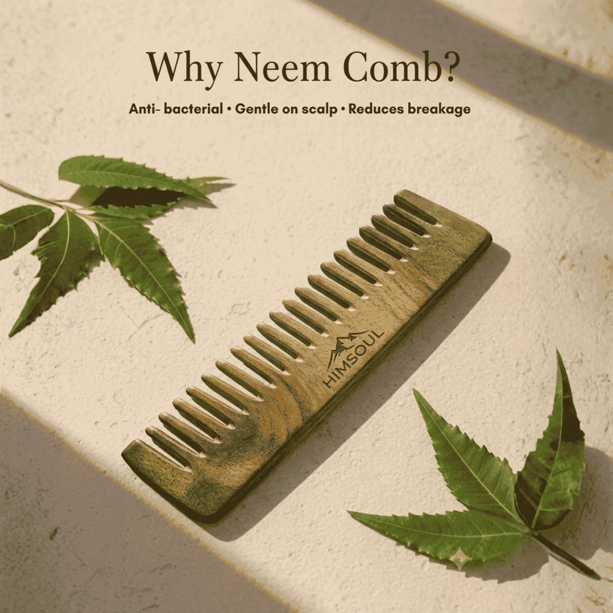 Himsoul wide-tooth natural neem wooden comb placed beside fresh neem leaves, offering anti-bacterial scalp protection and preventing hair breakage.