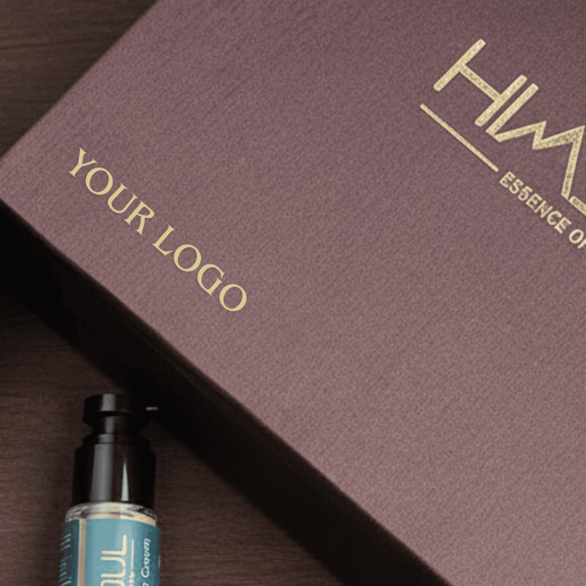 Himsoul co-branded corporate gift box featuring dual gold foil logo placement on textured mocha paper with skincare bottle.